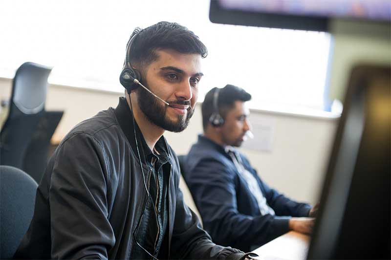 A customer service adviser taking a call.