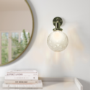 Dimpled Glass Globe Wall Light with Brass Finish - Salerno