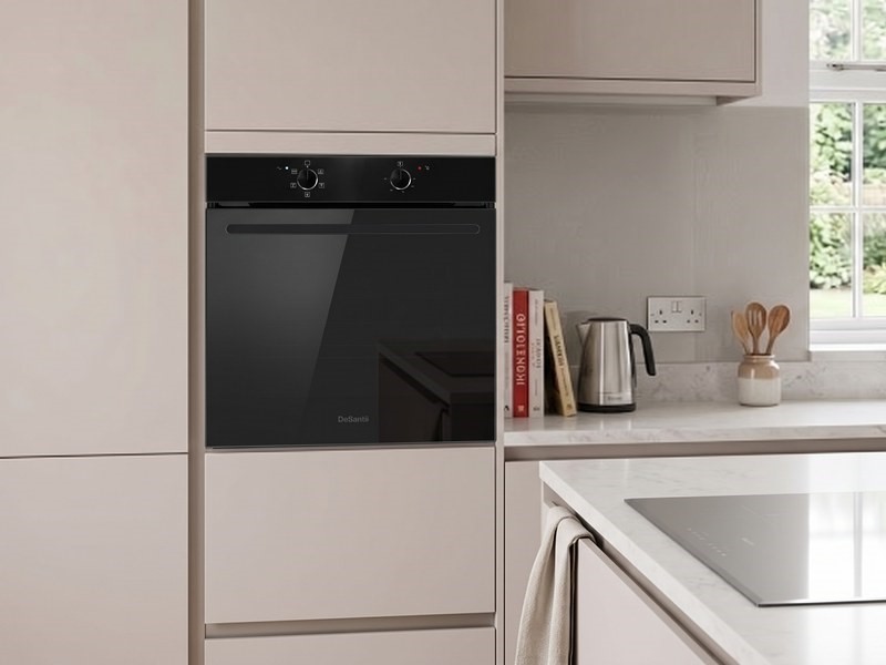 DeSantii black single oven built into a tall housing in a cream kitchen